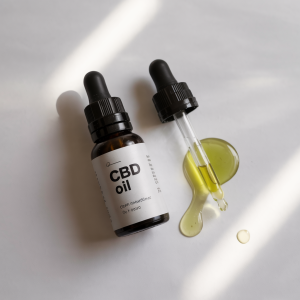 A nutritious meal paired with a CBD oil dropper highlighting CBD-infused nutrition